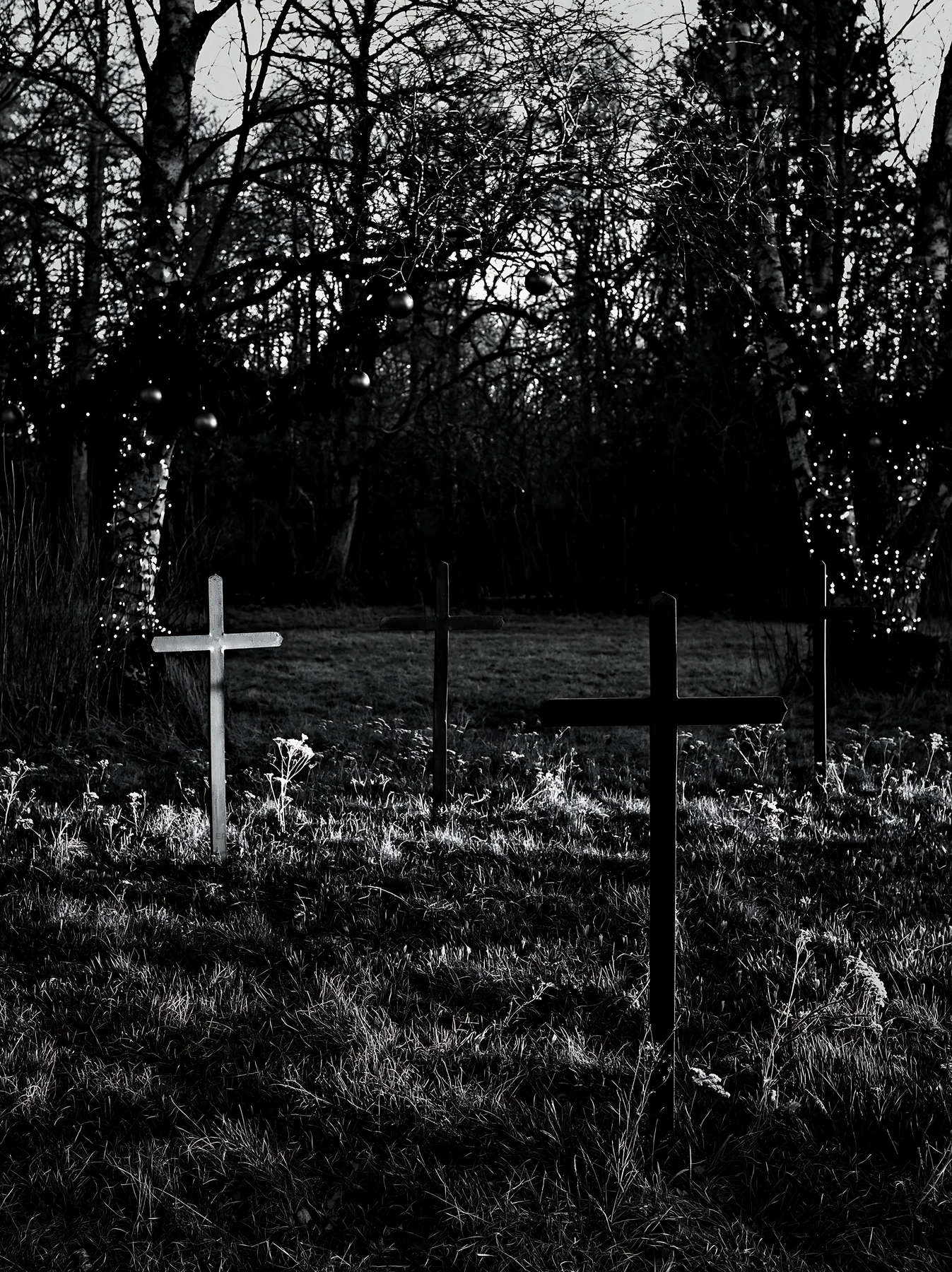 Three iron crosses in Advent meadow - AI-generated stock image