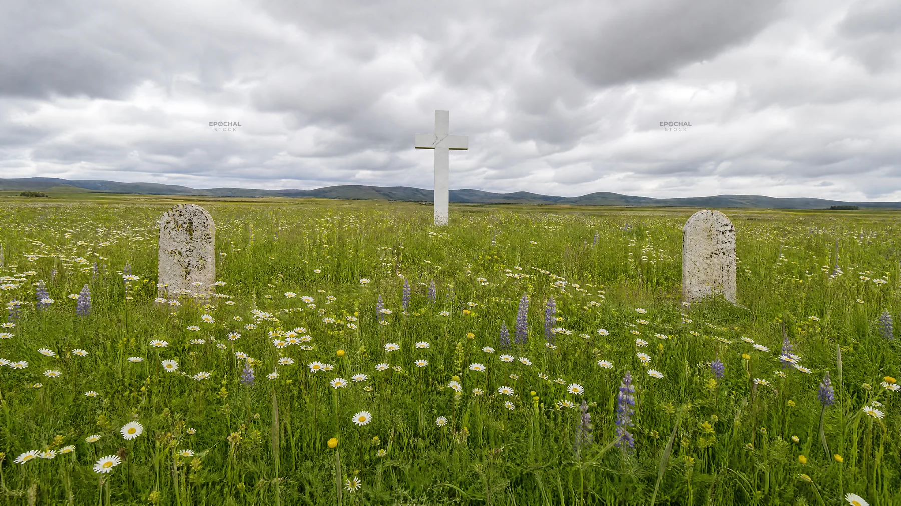Marble Christian cross in meadow with wildflowers - AI-generated stock image