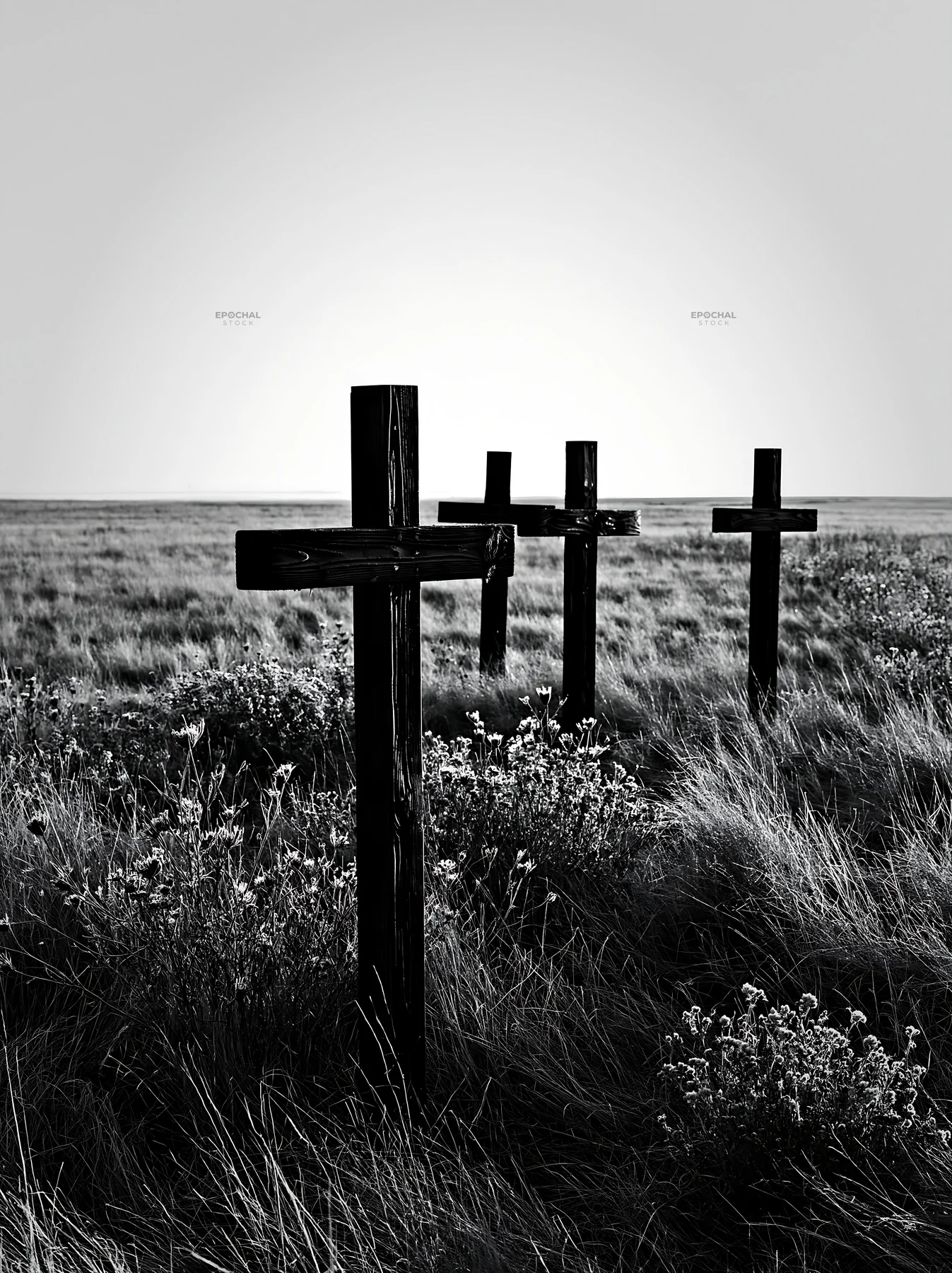 Wooden crosses in meadow with flowers during Christmas season - AI-generated stock image