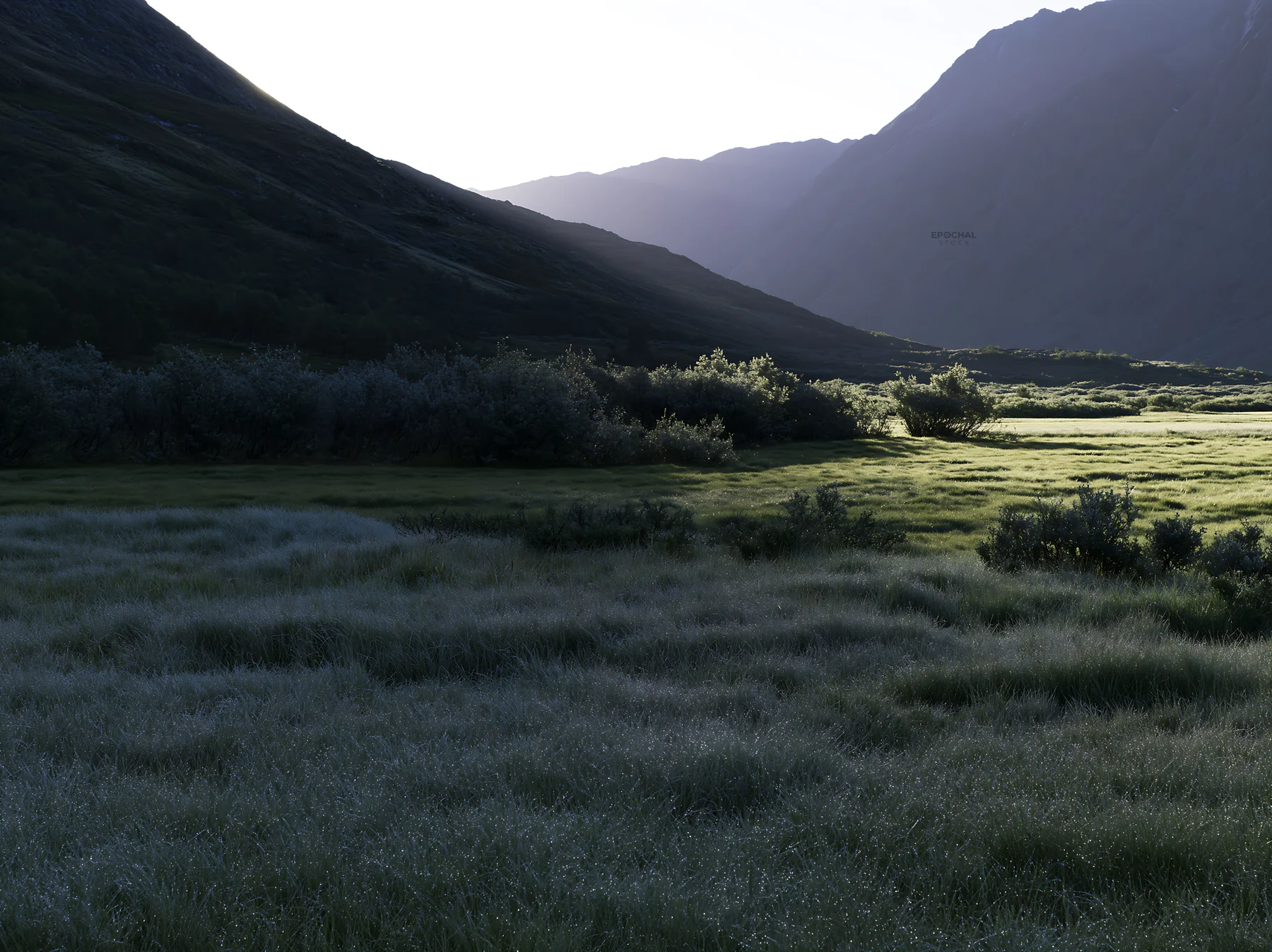 Sunlight shining on meadow in Jotunheimen valley - AI-generated stock image
