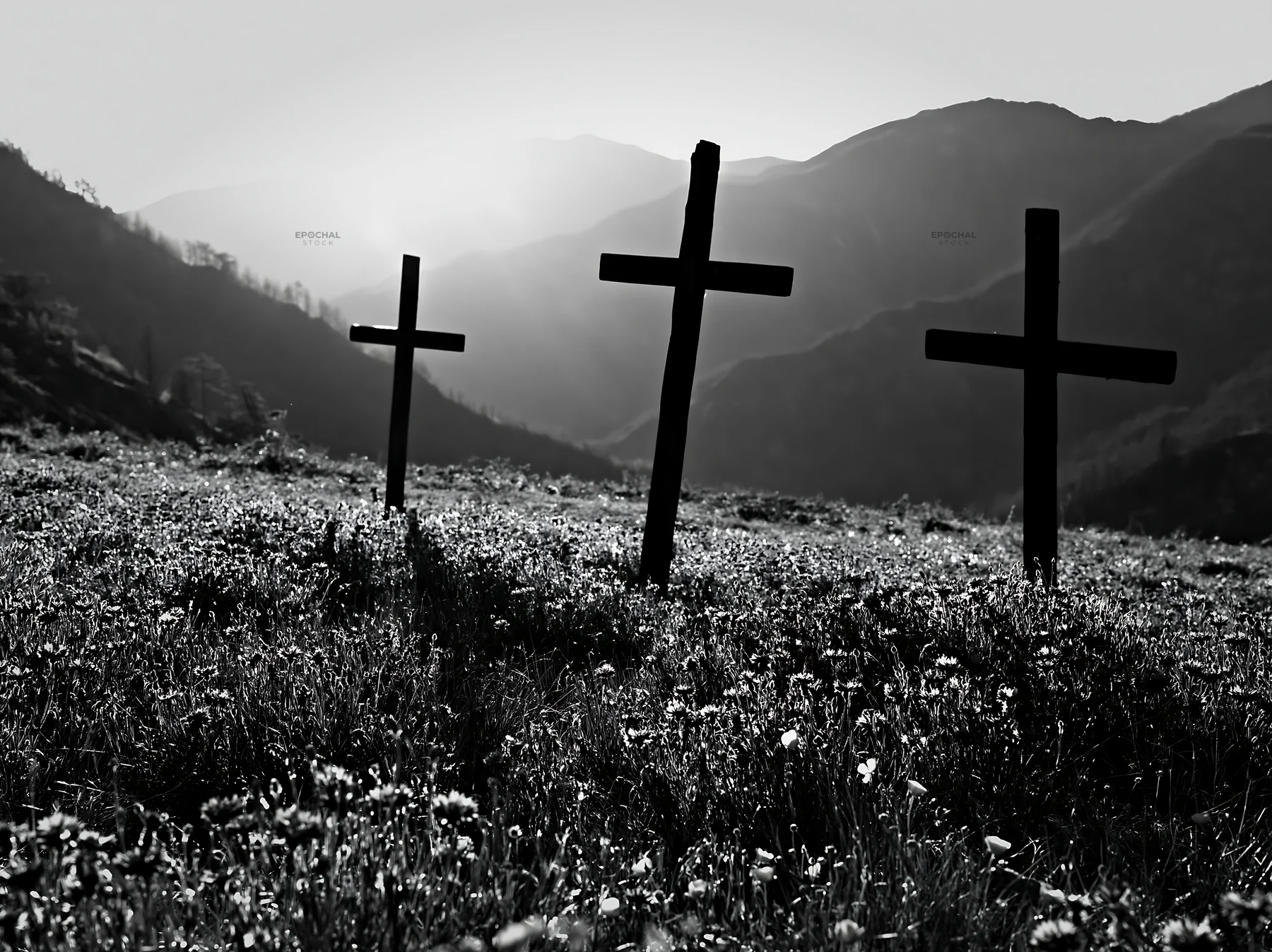 Three rustic crosses in a Christmas meadow with backlight - AI-generated stock image