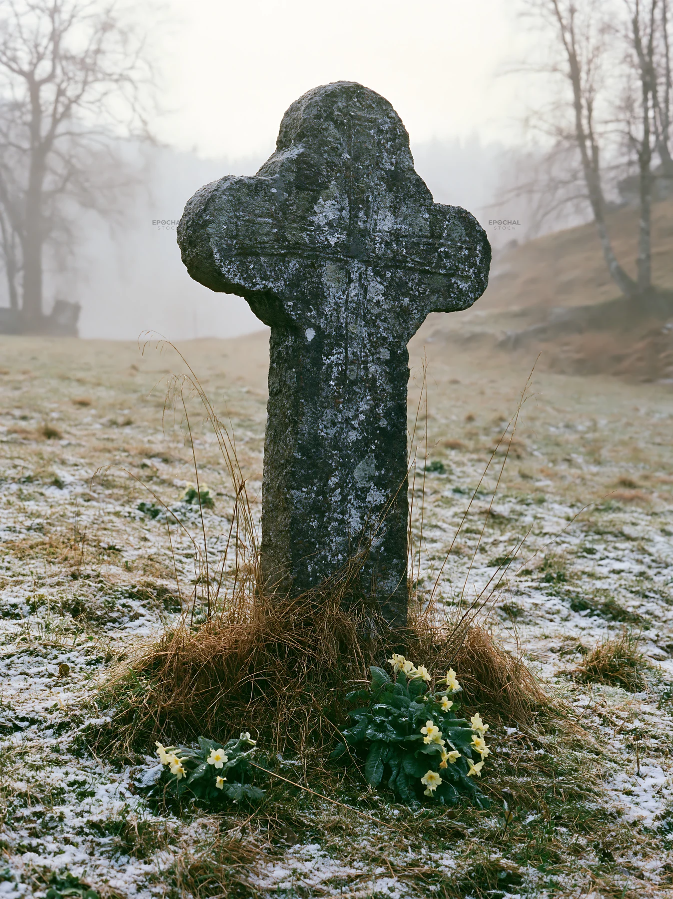 Stone Christian cross in snowy meadow - AI-generated stock image