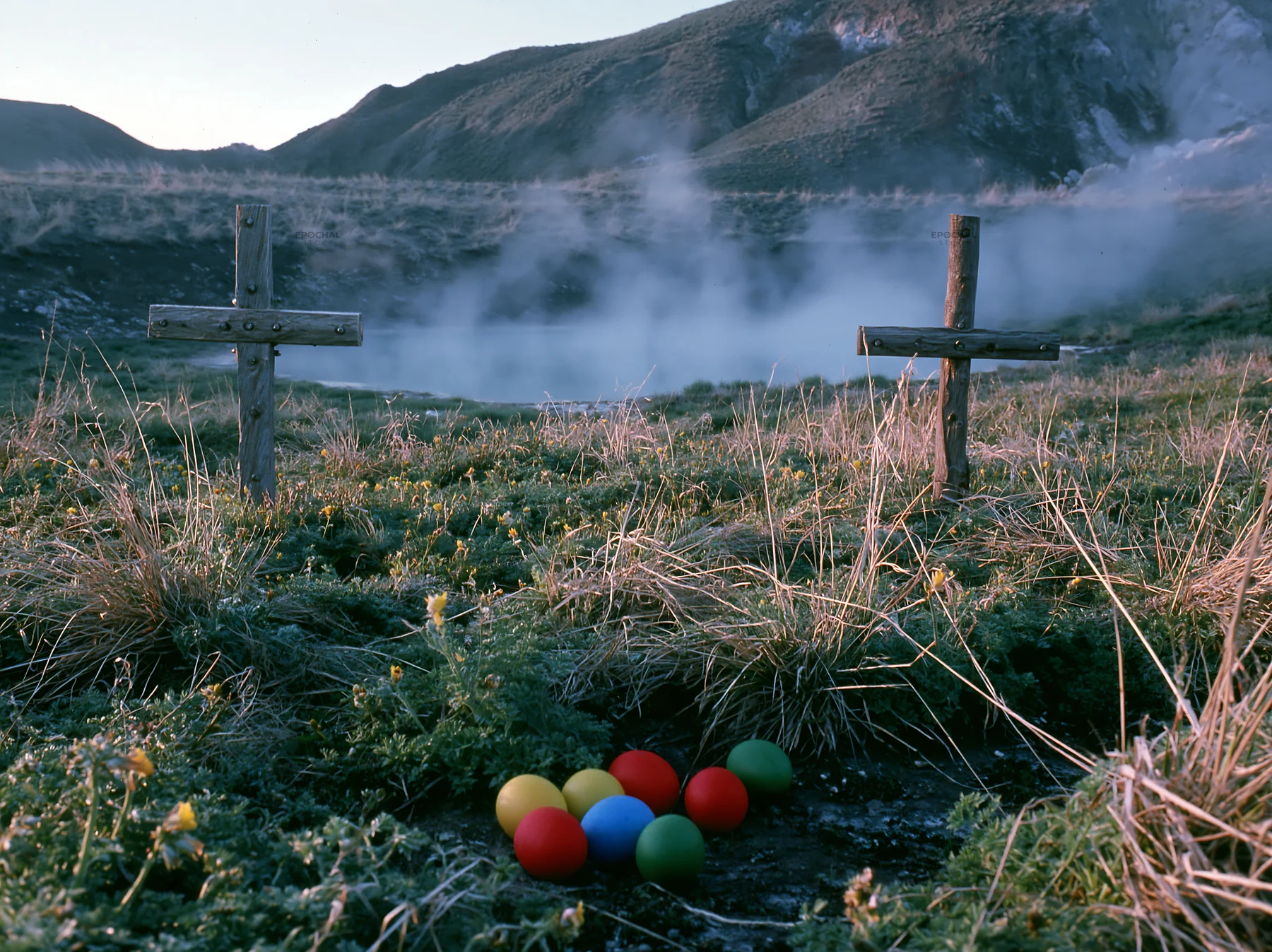 Christian crosses around geothermal spring meadow - AI-generated stock image