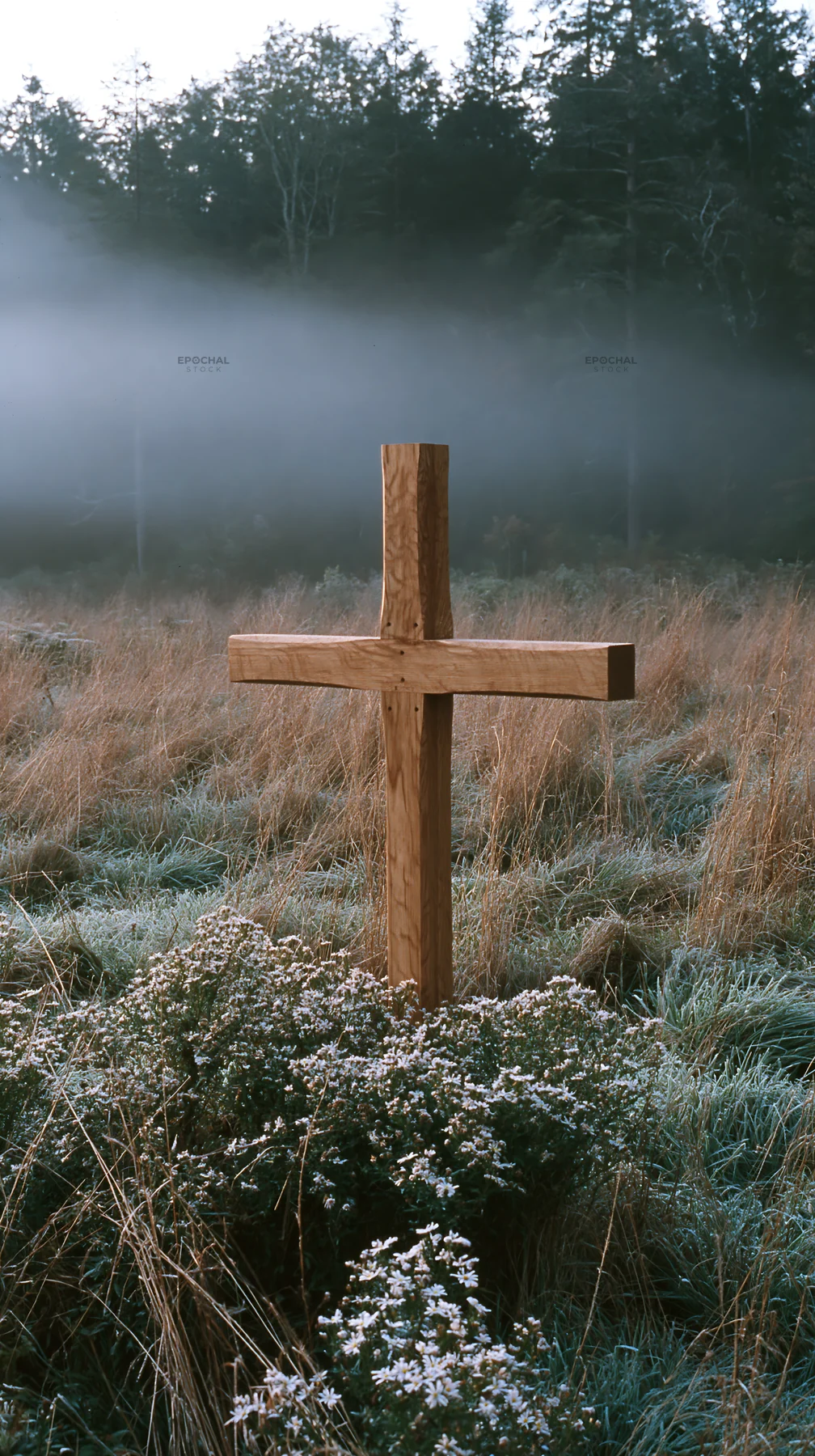 Carved oak cross stands in a frosted meadow - AI-generated stock image