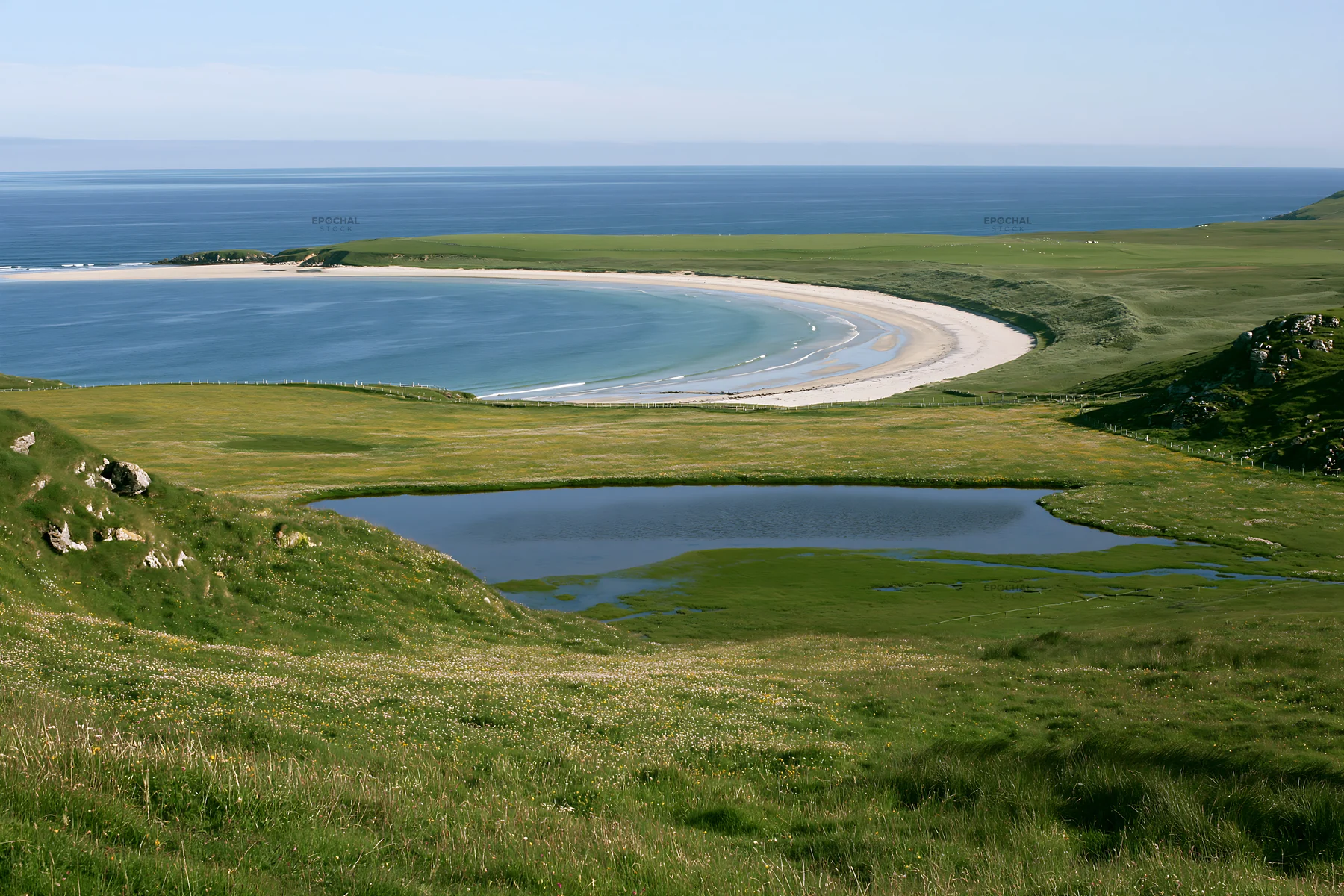 Machair beach meadow with calm water and distant shoreline - AI-generated stock image