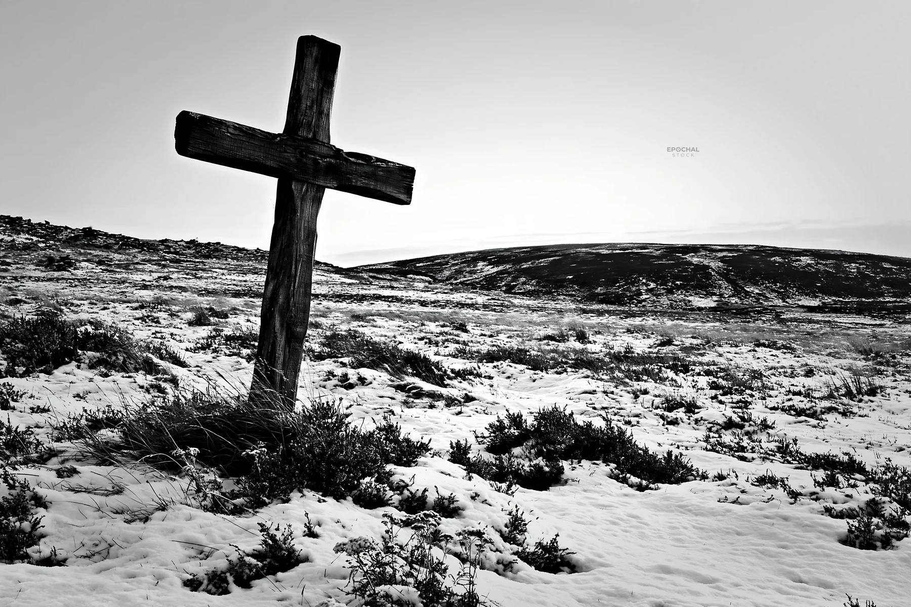 Rustic Christian cross in snow-covered winter meadow - AI-generated stock image