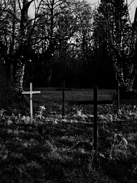 Three iron crosses in Advent meadow - AI-generated stock image