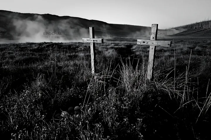 Crosses near thermal spring meadow in black and white - AI-generated stock image