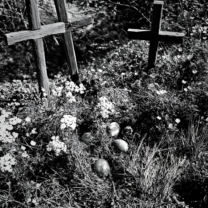 Christian crosses beside mineral spring meadow - AI-generated stock image