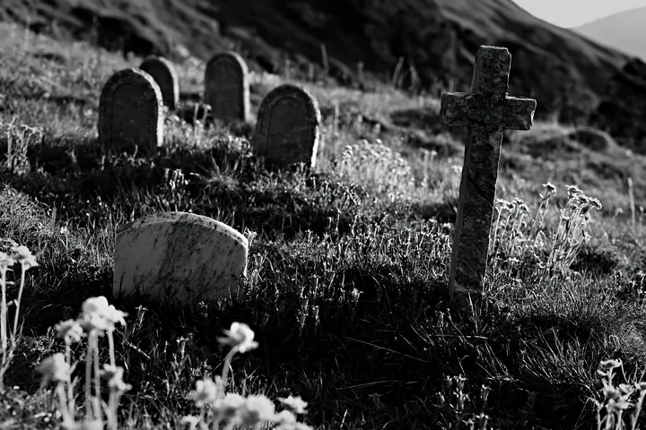 Christian cross in sunlit alpine meadow with flowers - AI-generated stock image