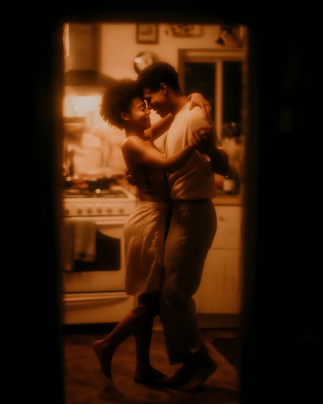 Couple dances closely in home kitchen at night Free Premium Stock Image - stock photo