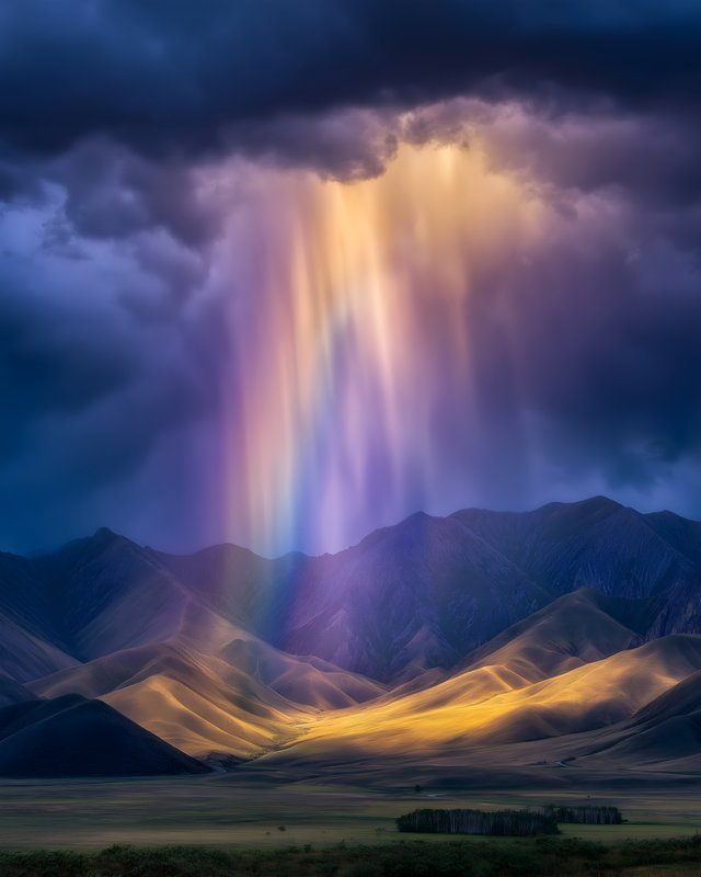 Mountains with light shining through clouds in the evening Free Premium Stock Photo - stock photo