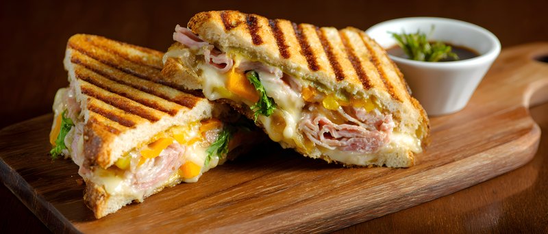 Grilled sandwich with ham and cheese served with sauce Free Premium Stock Photo - stock photo