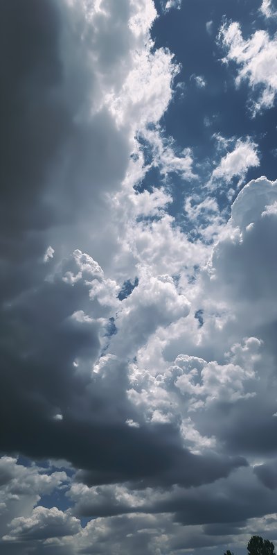 Clouds gather in the sky on a bright day in nature Free Premium Stock Photo - stock photo