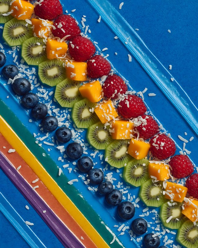 Colorful fruit arrangement on a blue background Free Premium Stock Image - stock photo