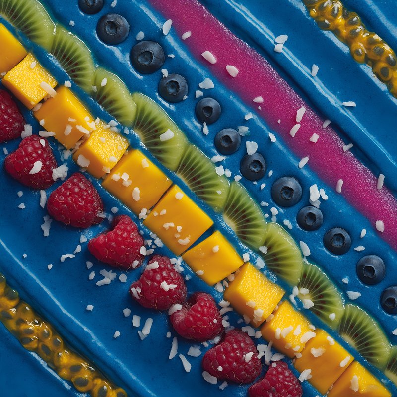 Colorful smoothie bowl with fruits and toppings Free Premium Stock Image - stock photo
