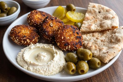 Crispy Goetta Sesame Patties with Hummus - stock photo