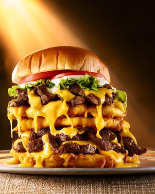 Jibarito Burger Stacked High with Melted Cheese and Crispy Plantains - stock photo