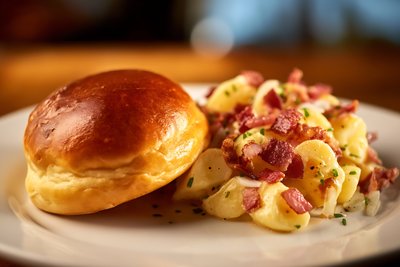 Freshly Baked Bierocks with Crispy Bacon Potato Hash - stock photo