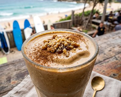Tahini Date Shake with Cinnamon at Beach - stock photo