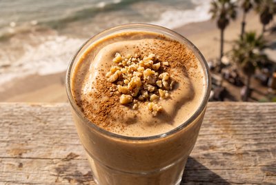 Tahini Date Shake with Walnuts at Beach - stock photo