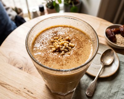 Tahini Date Shake Topped with Cinnamon - stock photo