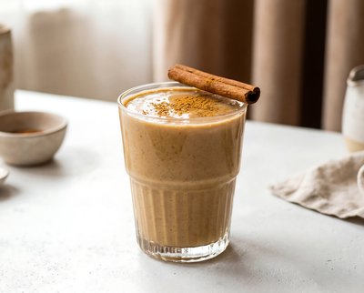 Creamy Tahini Date Shake with Cinnamon Stick - stock photo