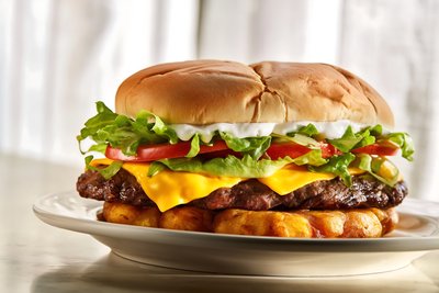 Jibarito Burger with Plantain Bun, Beef Patties, Cheese, and Fresh Greens - stock photo