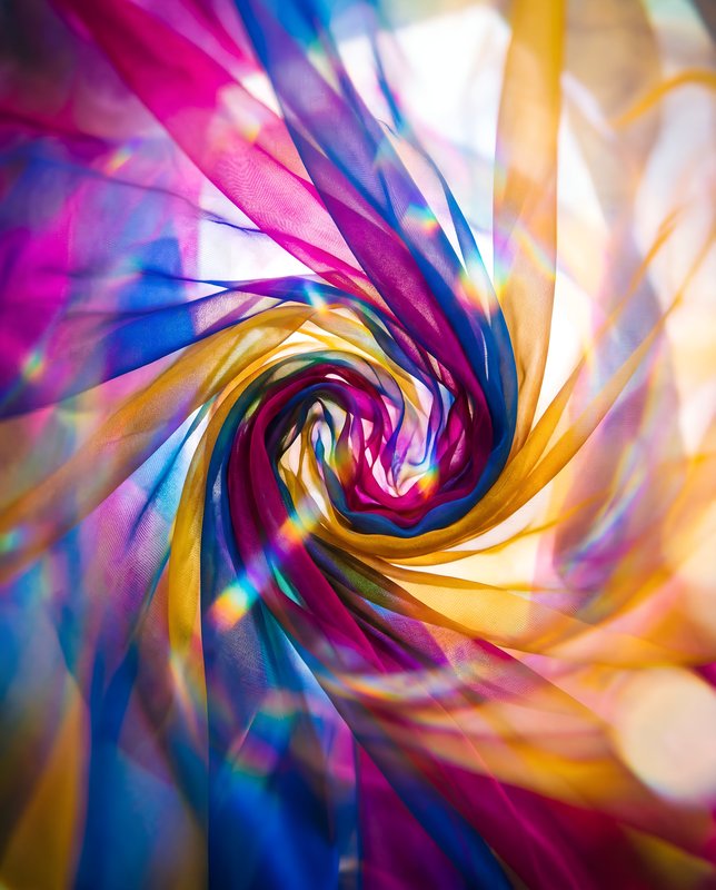 Colorful fabric swirls in a dynamic motion at an event Premium Stock Photo - stock photo