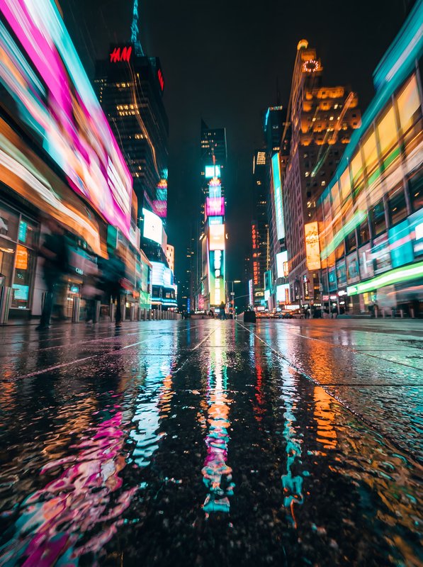 Bright lights and reflections in Times Square at night Premium Stock Image - stock photo