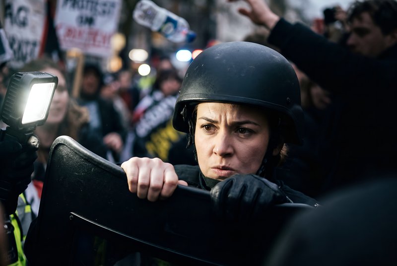 Protest at city center with police response to crowd Premium Stock Image - stock photo