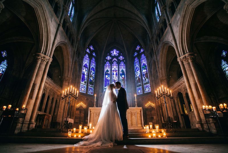 Couple shares a moment in a church during a wedding ceremony Premium Stock Image - stock photo