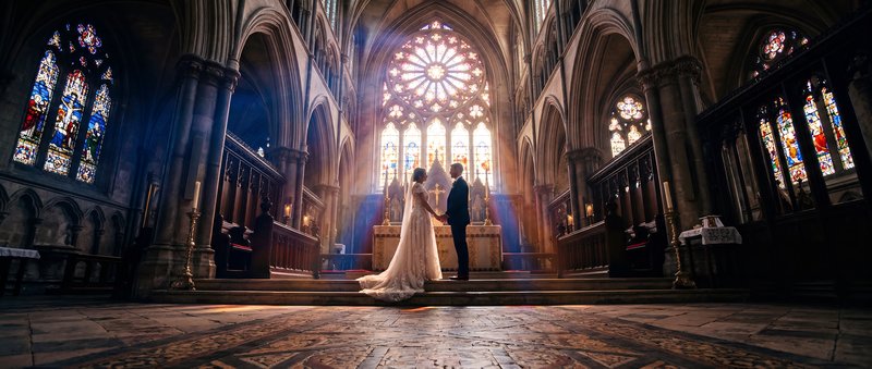 Couple exchanges vows in a church during a wedding ceremony Premium Stock Image - stock photo