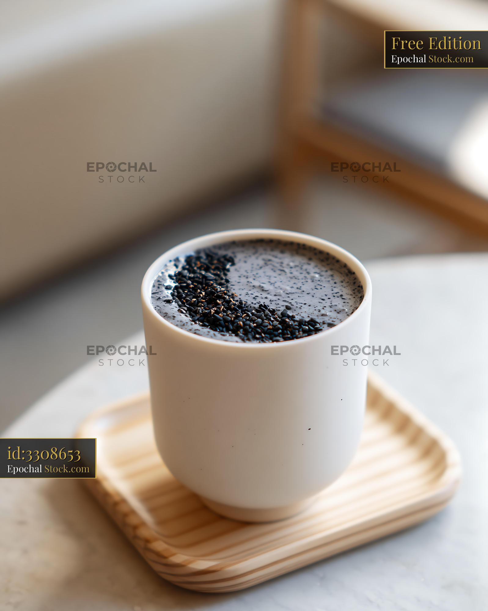 Kurogoma smoothie with black sesame seeds in a white ceramic cup - stock photo