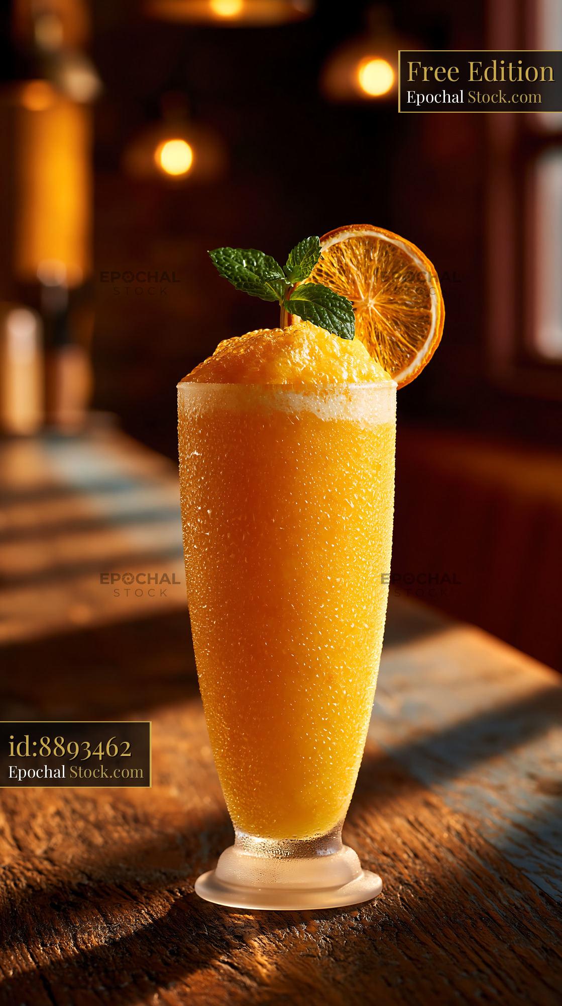 Hallabong citrus smoothie with mint and dried orange on a bar counter - stock photo