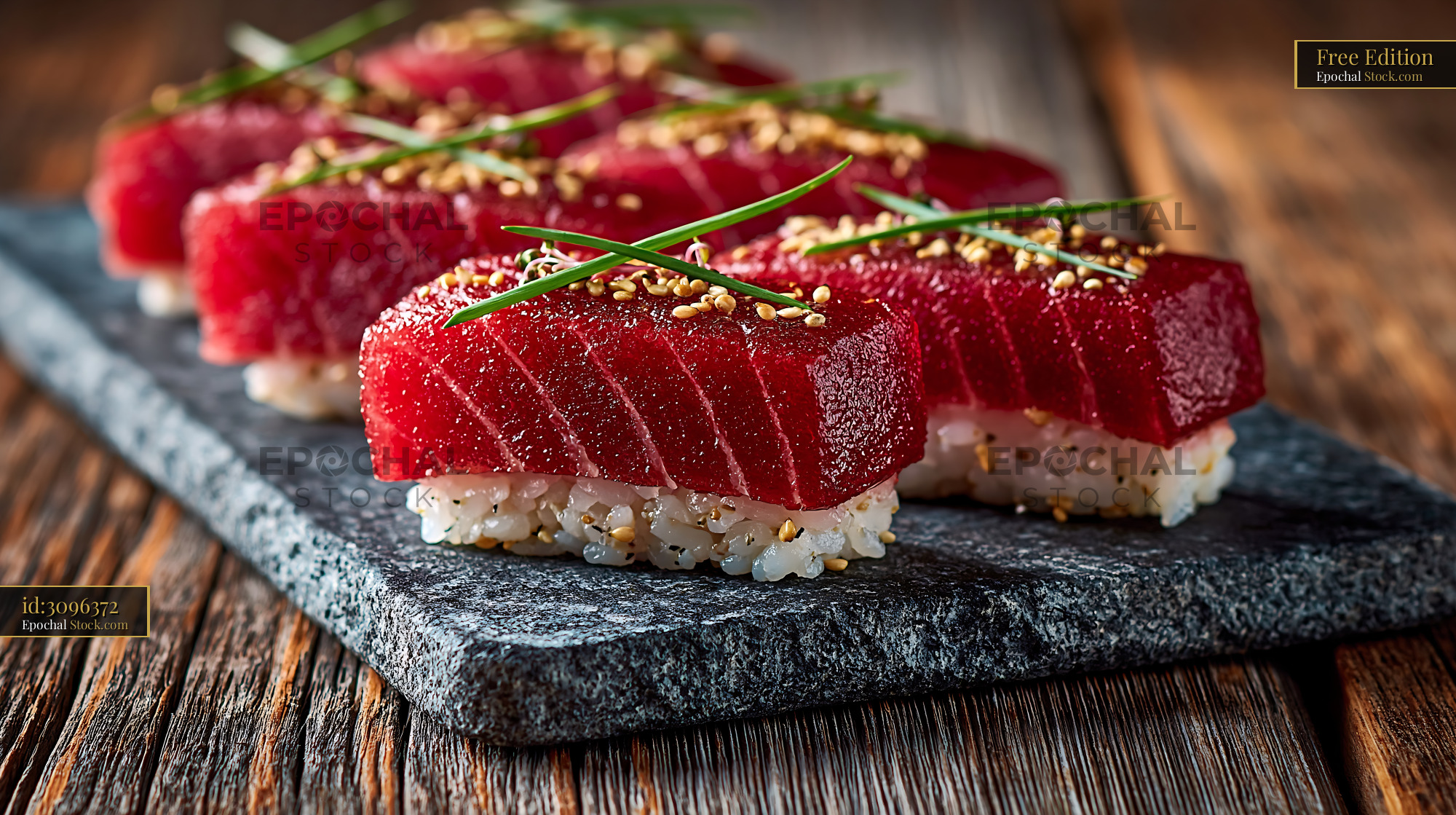 Vegan watermelon tuna sushi nigiri served on a dark slate plate - stock photo