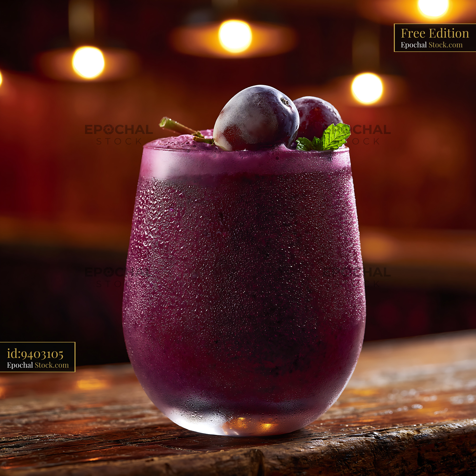 Chilled kyoho grape smoothie with fresh garnish in a moody bar - stock photo