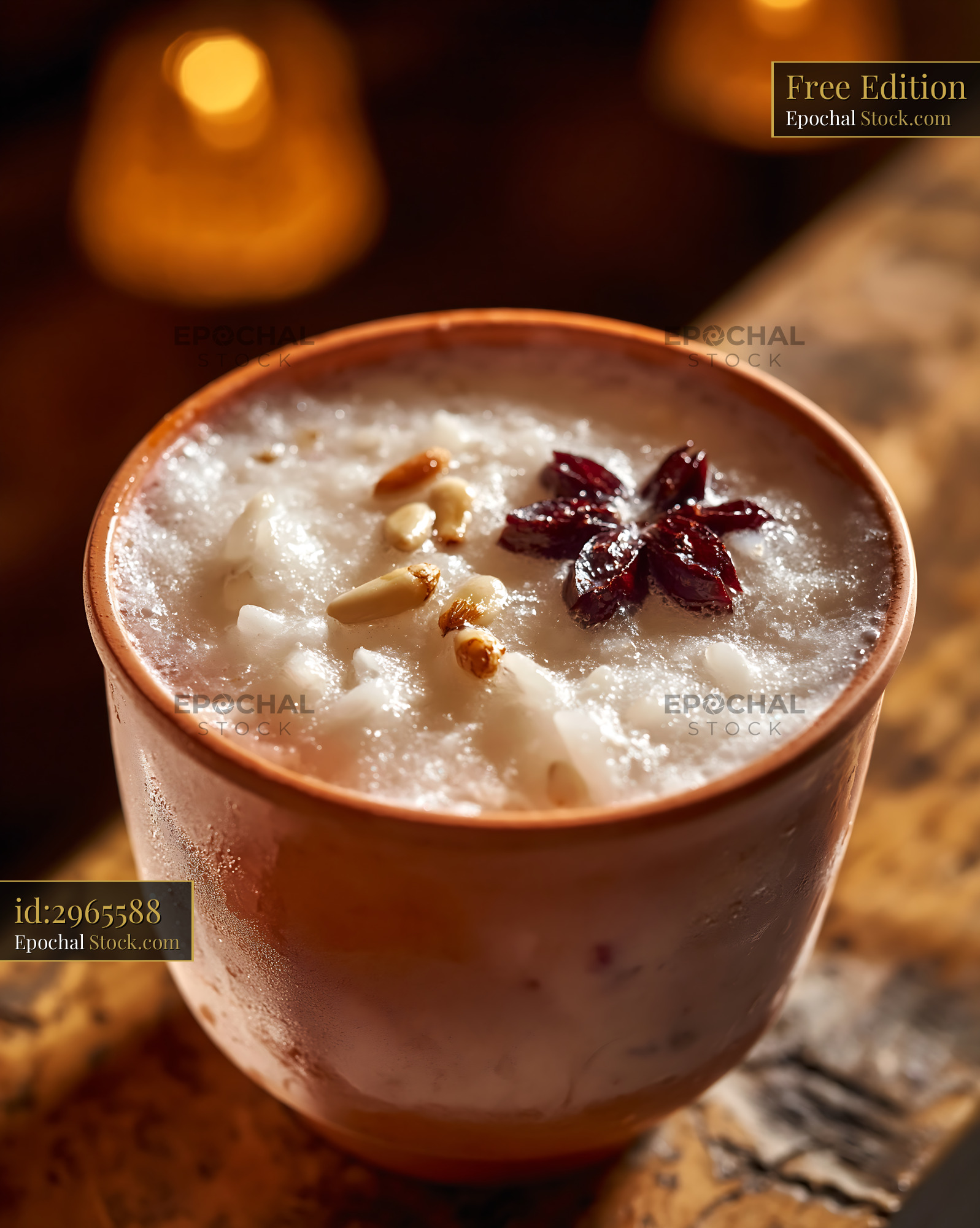Sikhye rice smoothie in a terracotta cup with pine nuts and jujube - stock photo