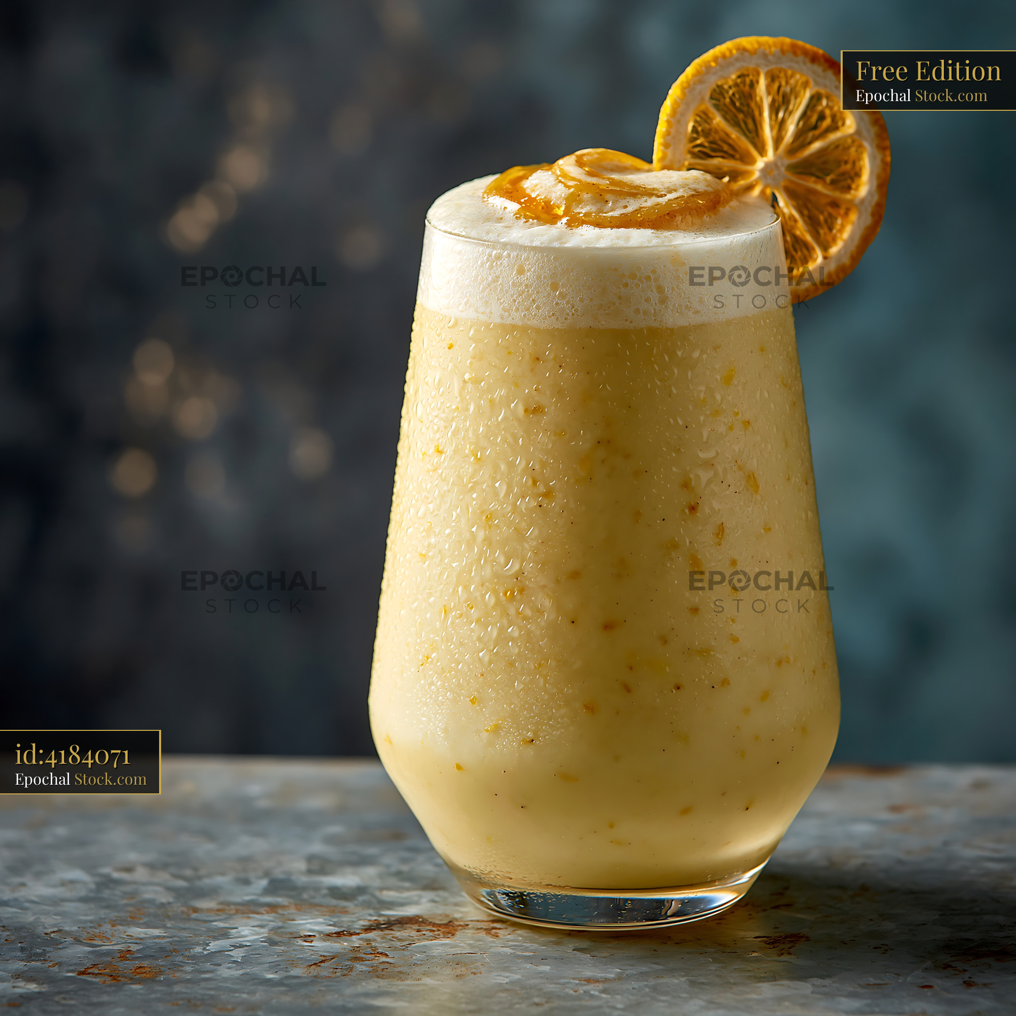 Refreshing yuzu honey smoothie with foam and dried citrus garnish - stock photo