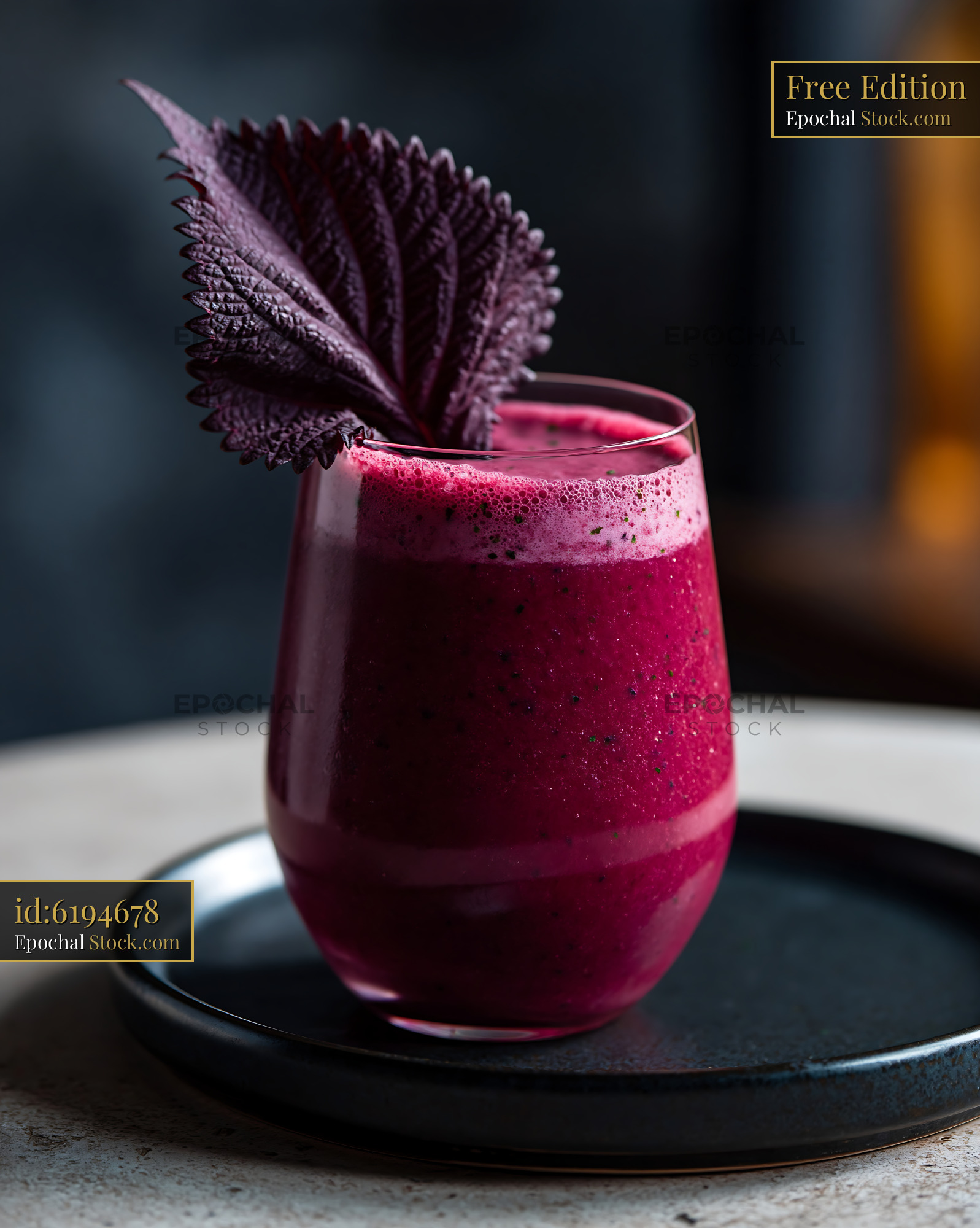 Vibrant purple shiso leaf smoothie served in a glass with garnish - stock photo