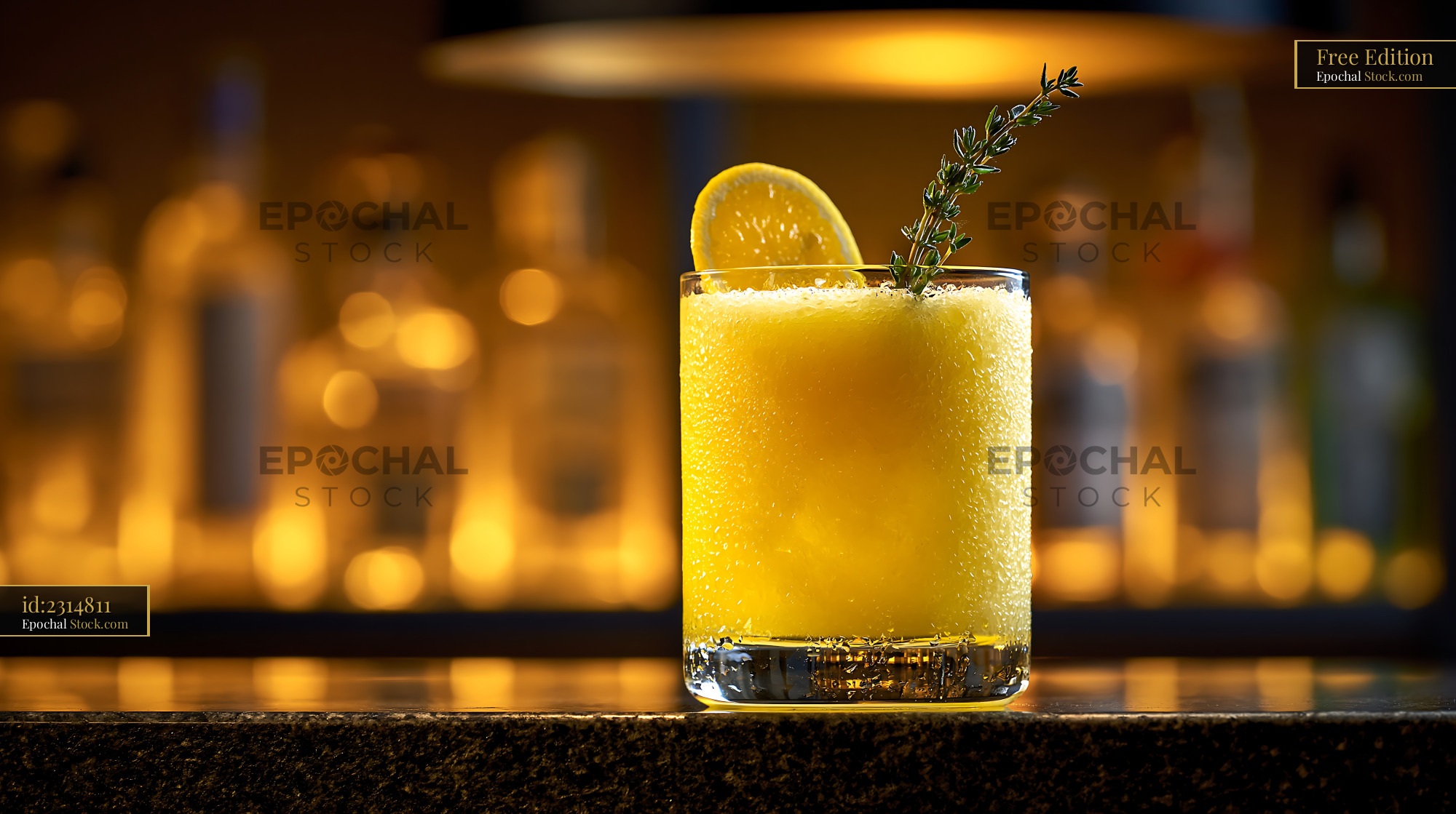Yuja citron smoothie with lemon and thyme garnish on a bar counter - stock photo