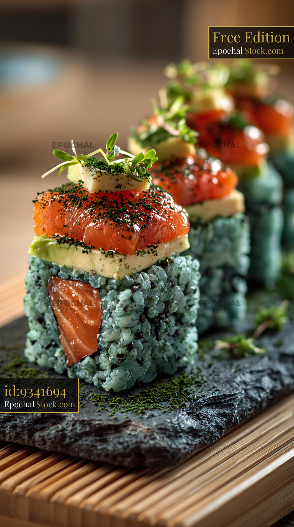 Salmon and avocado sushi with blue spirulina rice on slate - stock photo