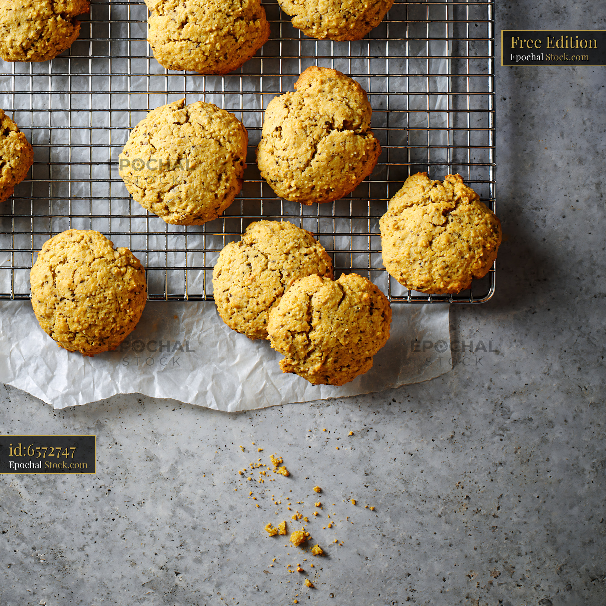 Freshly baked cardamom chickpea biscuits cooling on a wire rack - stock photo
