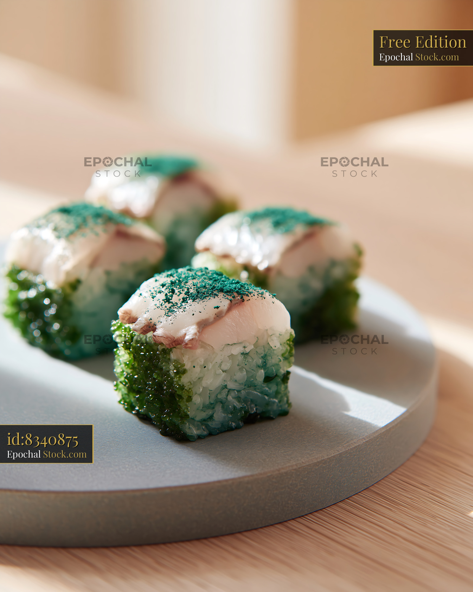 Spirulina powder sushi cubes with fresh fish on a minimalist plate - stock photo