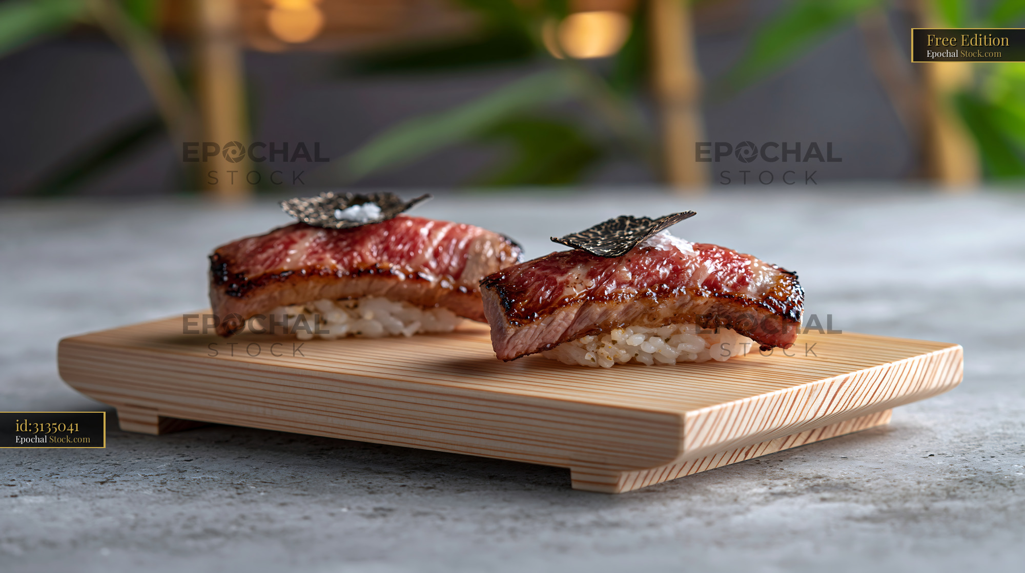 Aburi wagyu sushi with black truffle and sea salt on wooden board - stock photo