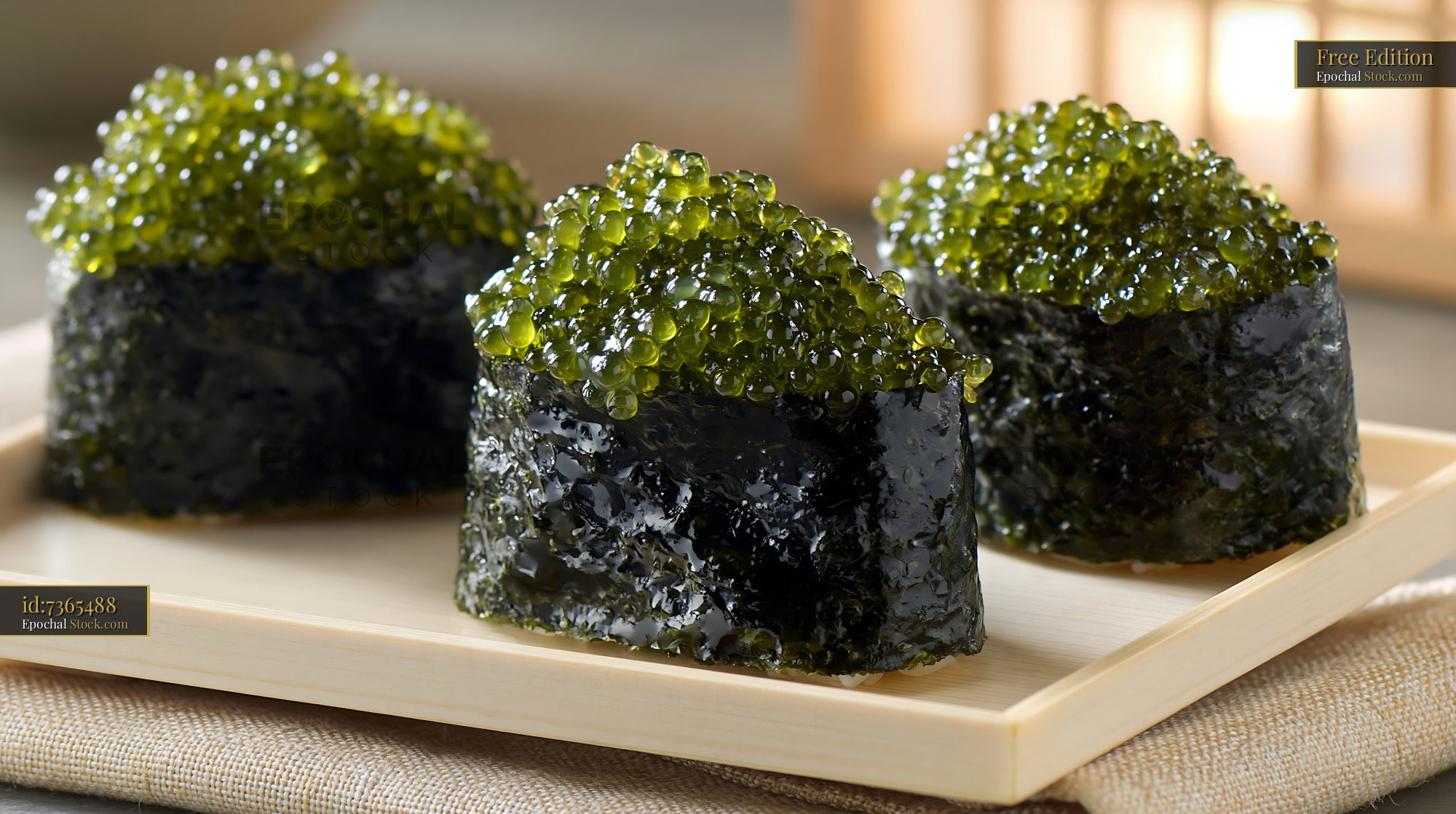 Fresh umi budo sushi with green sea grapes on a wooden tray - stock photo