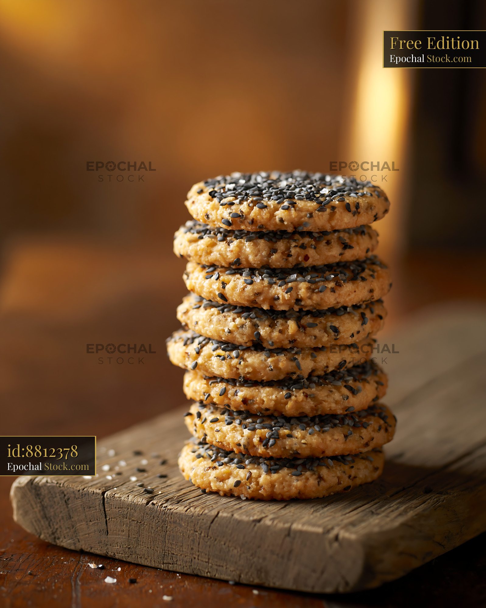 Stack of homemade nigella seed biscuits on a rustic wooden board - stock photo