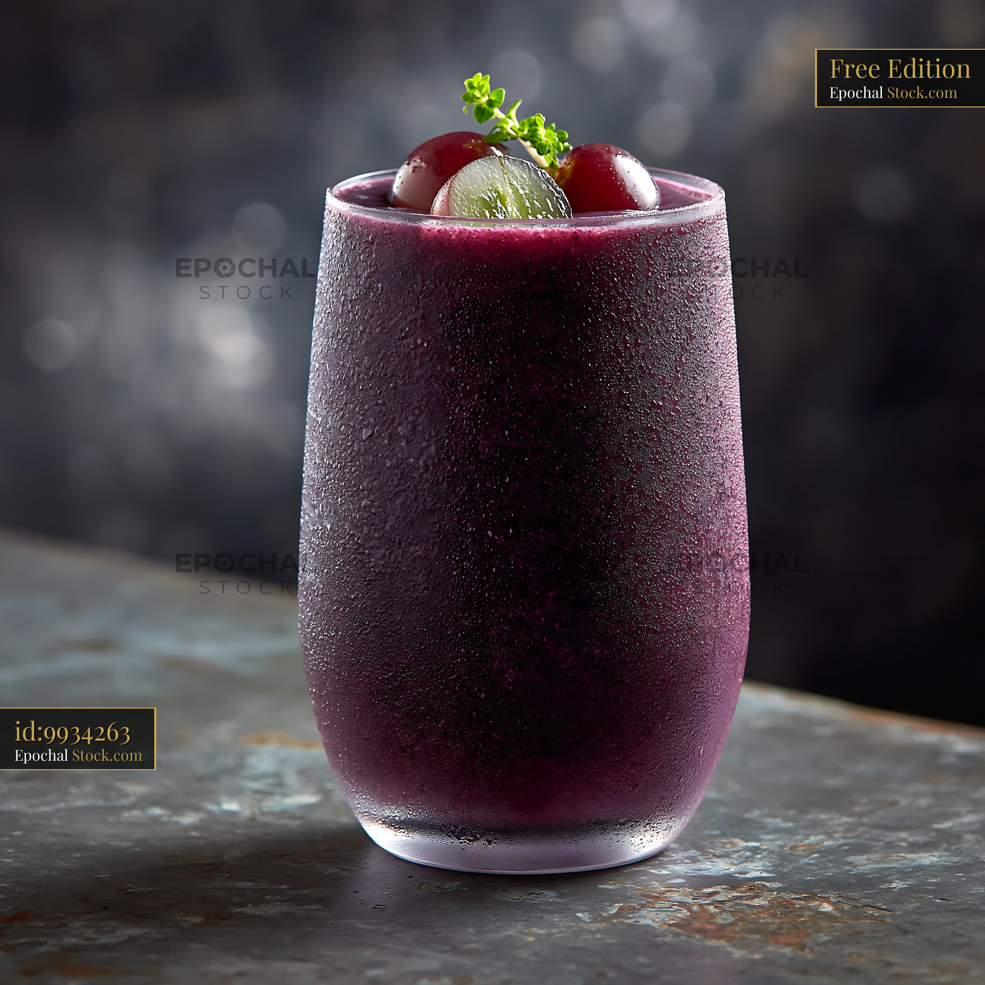 Cold kyoho grape smoothie in a frosted glass with fresh fruit garnish - stock photo