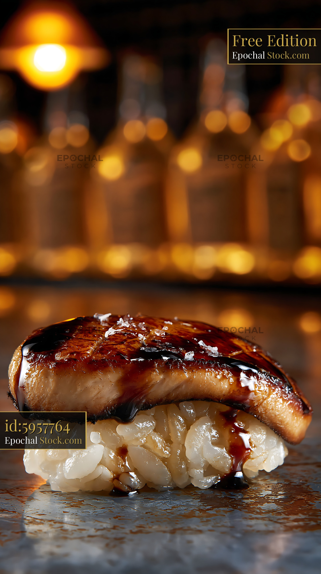 Foie gras nigiri sushi with dark glaze and sea salt in a bar - stock photo