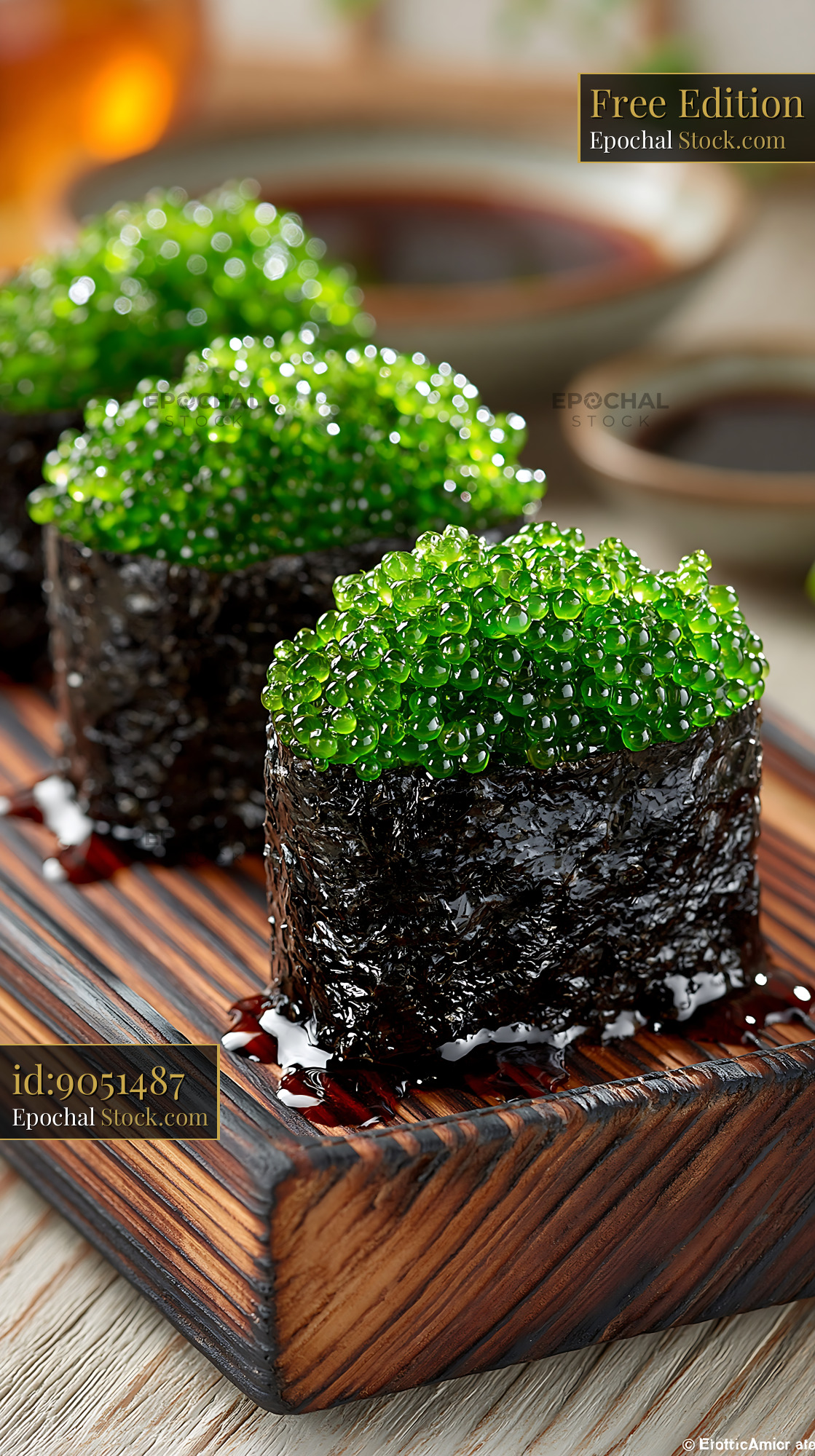 Salted plum umeboshi sushi with vibrant green seaweed pearls - stock photo